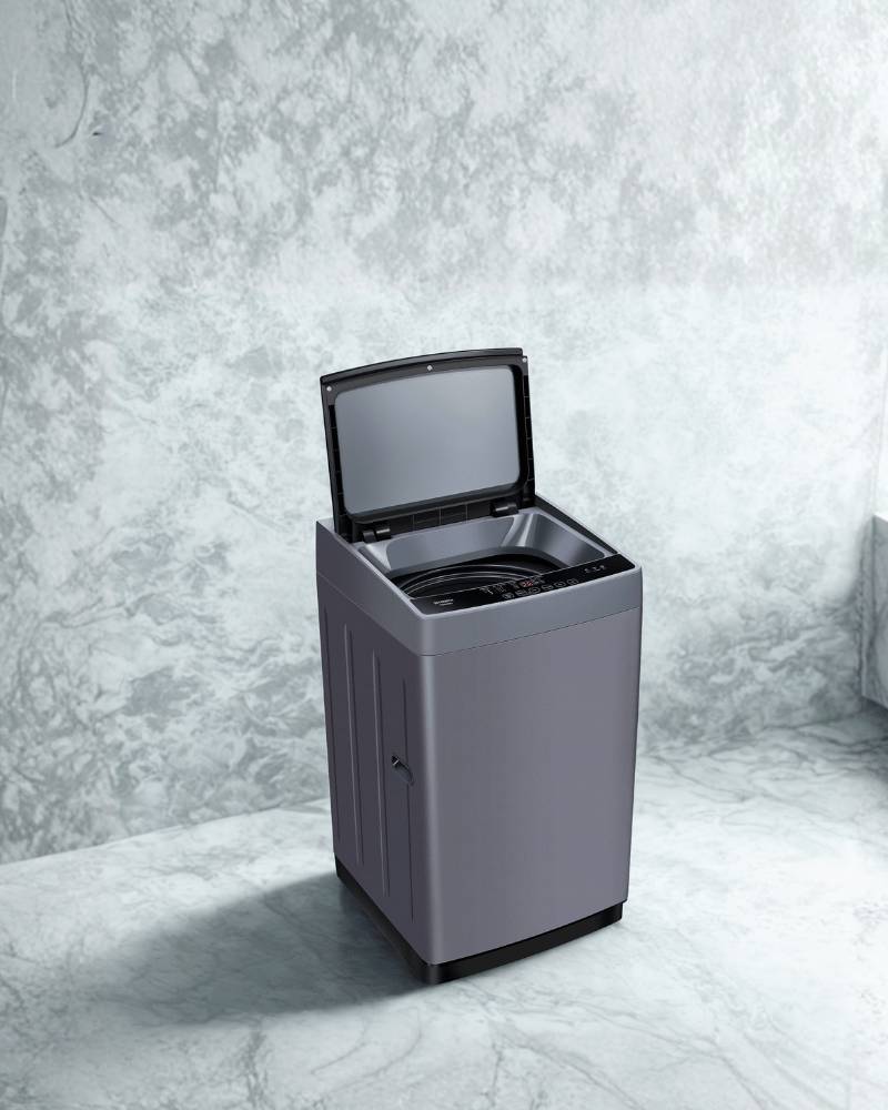 Panasonic 9KG top load washing machine T90M26NJ with open lid displayed on a grey textured background.