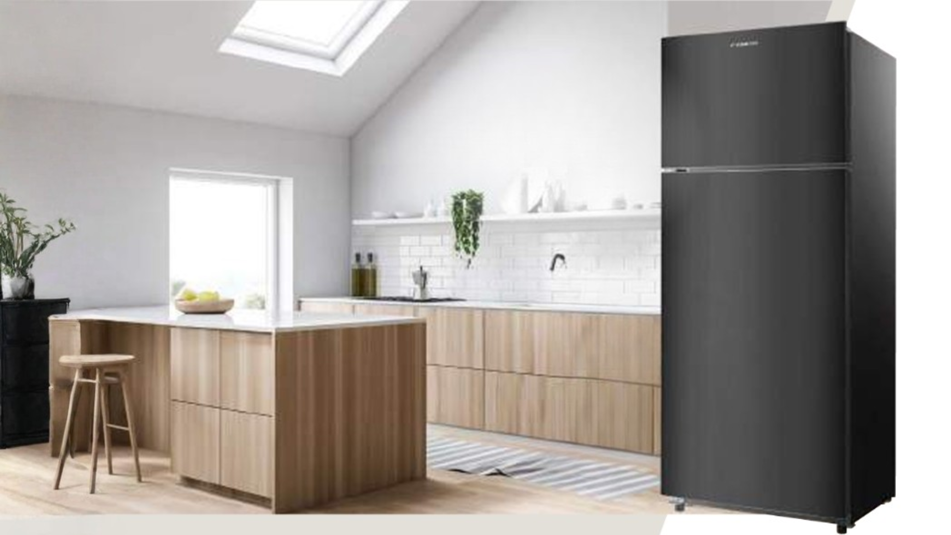 Modern kitchen interior with light wood cabinetry and a skylight, featuring a standalone black two-door refrigerator displayed prominently on the right