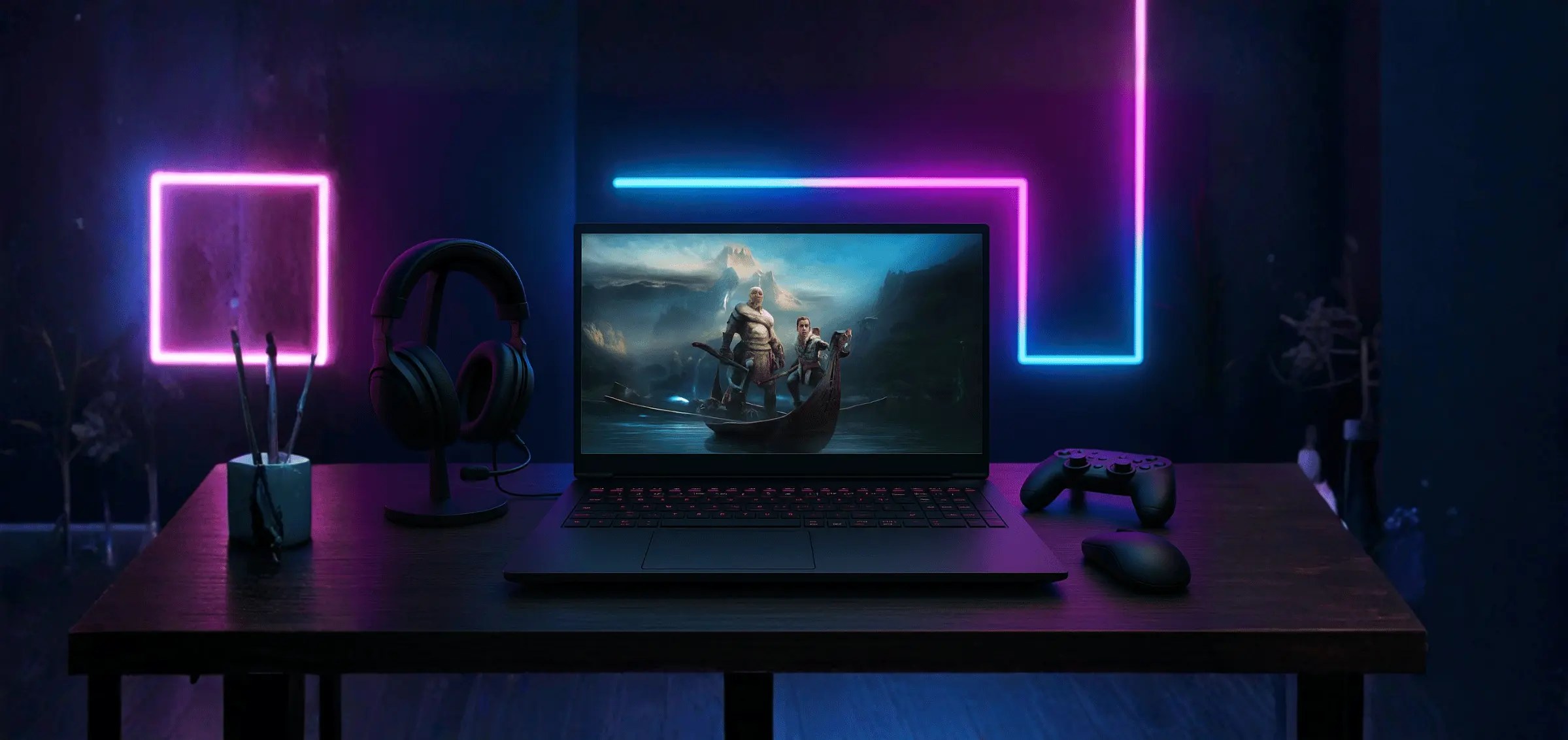 RGB gaming setup featuring a laptop running an action game, a headset, a controller, and neon pink and blue wall lights behind the desk.