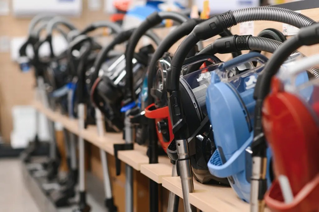 Best Vacuum Cleaner Malaysia Guide. A store display showing various models to help you find the best vacuum cleaner.